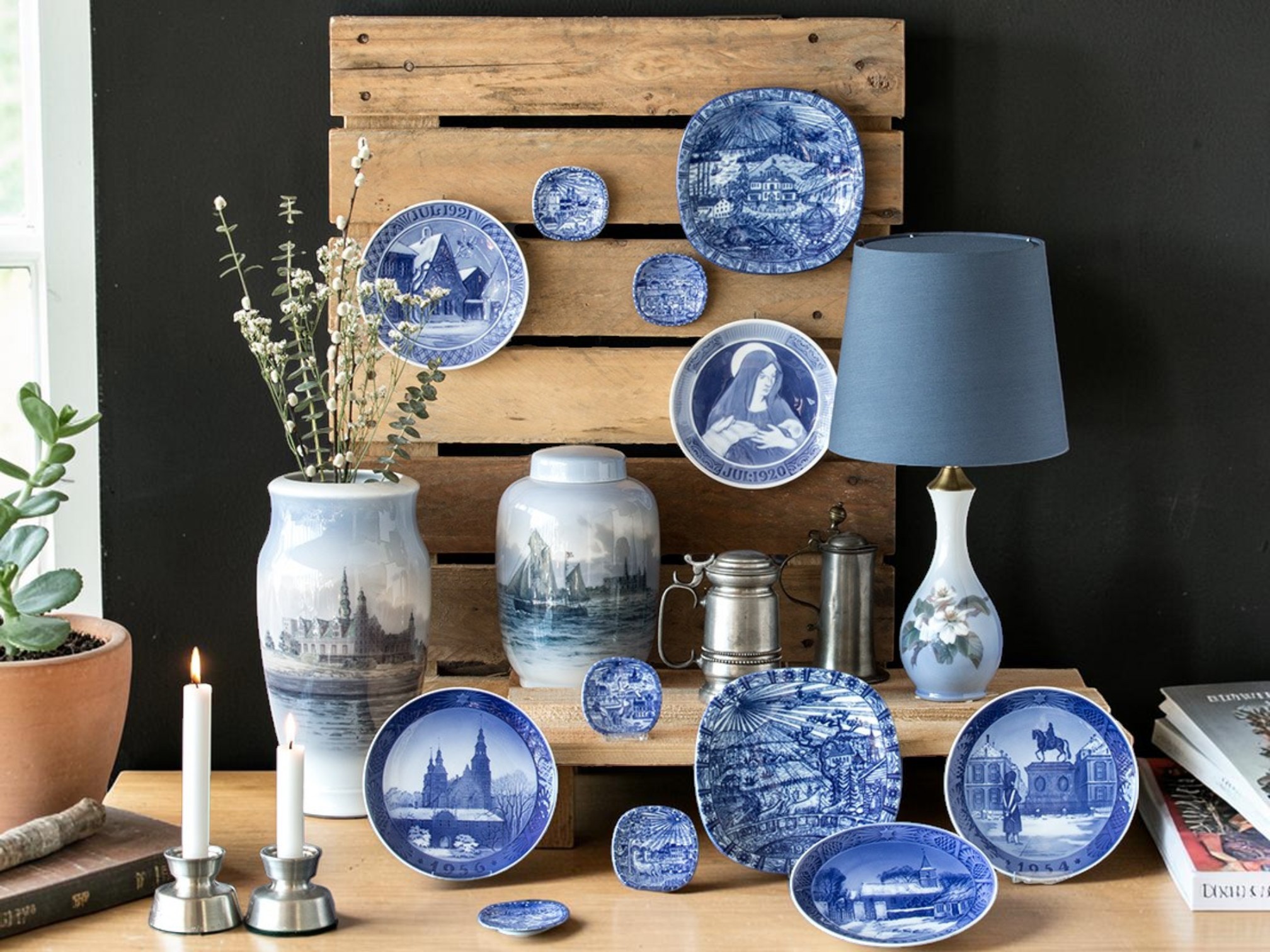 Mixed porcelain Christmas plates decorating the home